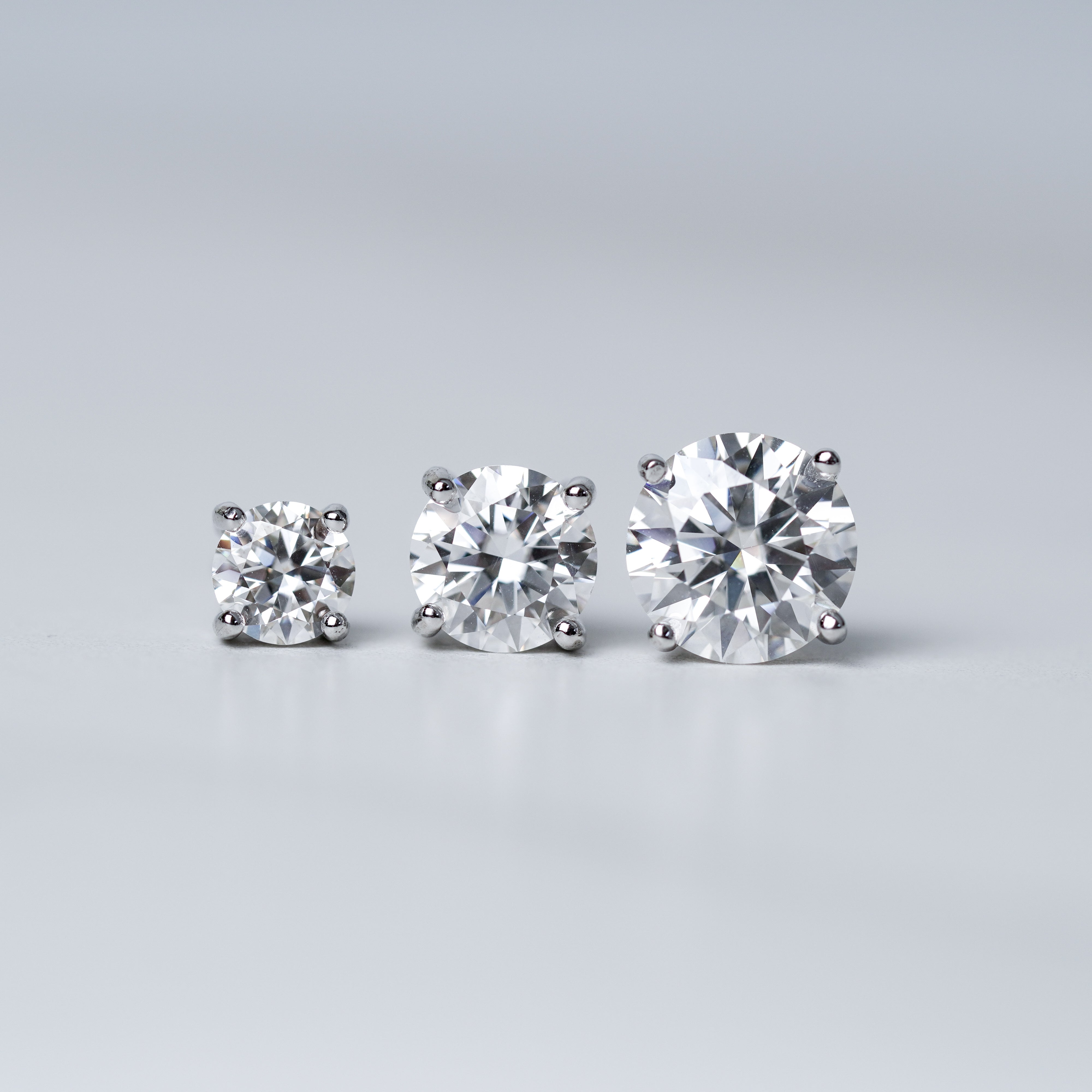 Round Solitaire Stud Earrings - Screwed Back