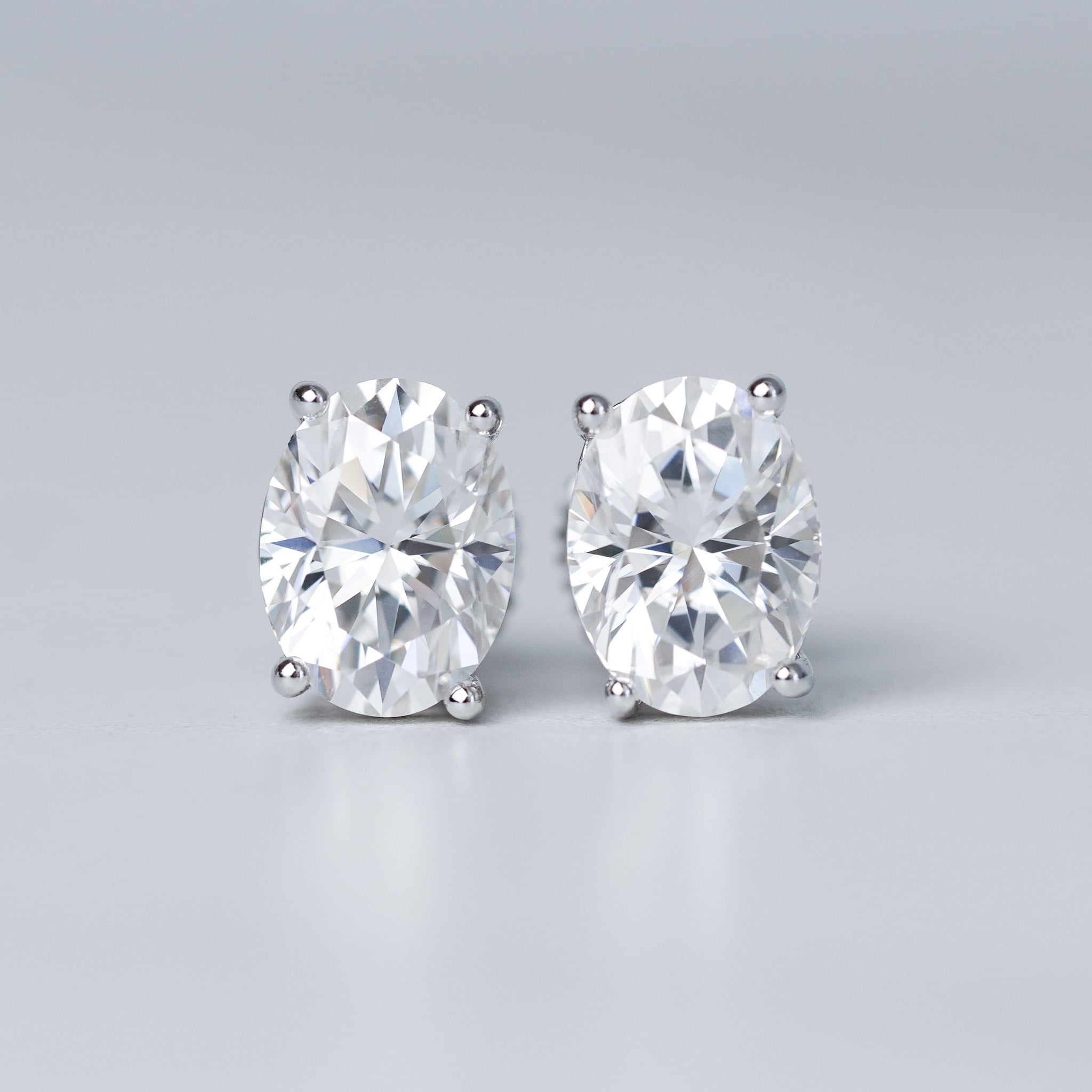 Moissanite Oval Cut Solitaire Stud Earrings - Screwed Back